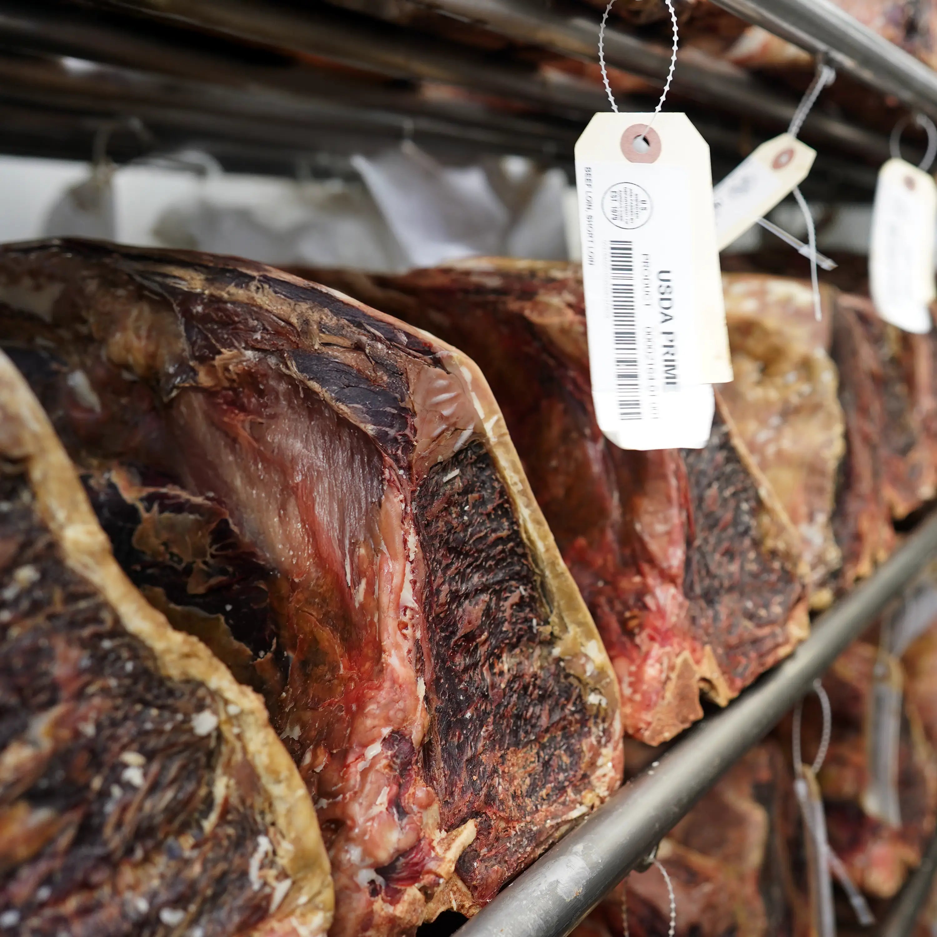 racks of steaks aging next to each other