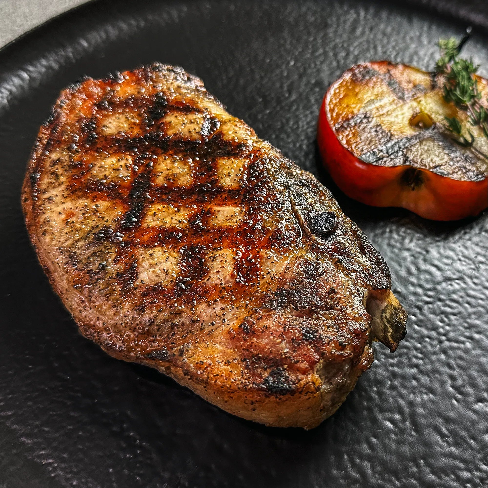 Cooked Bone-IN pork Chop on Plate