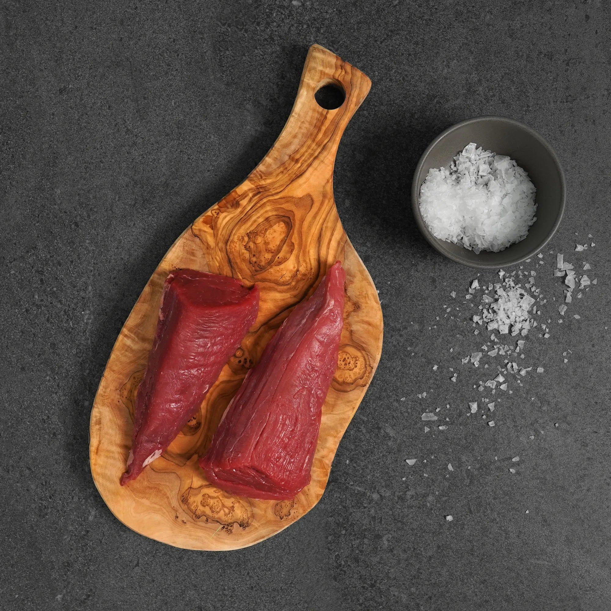 Choice Tenderloin Tails on cutting board