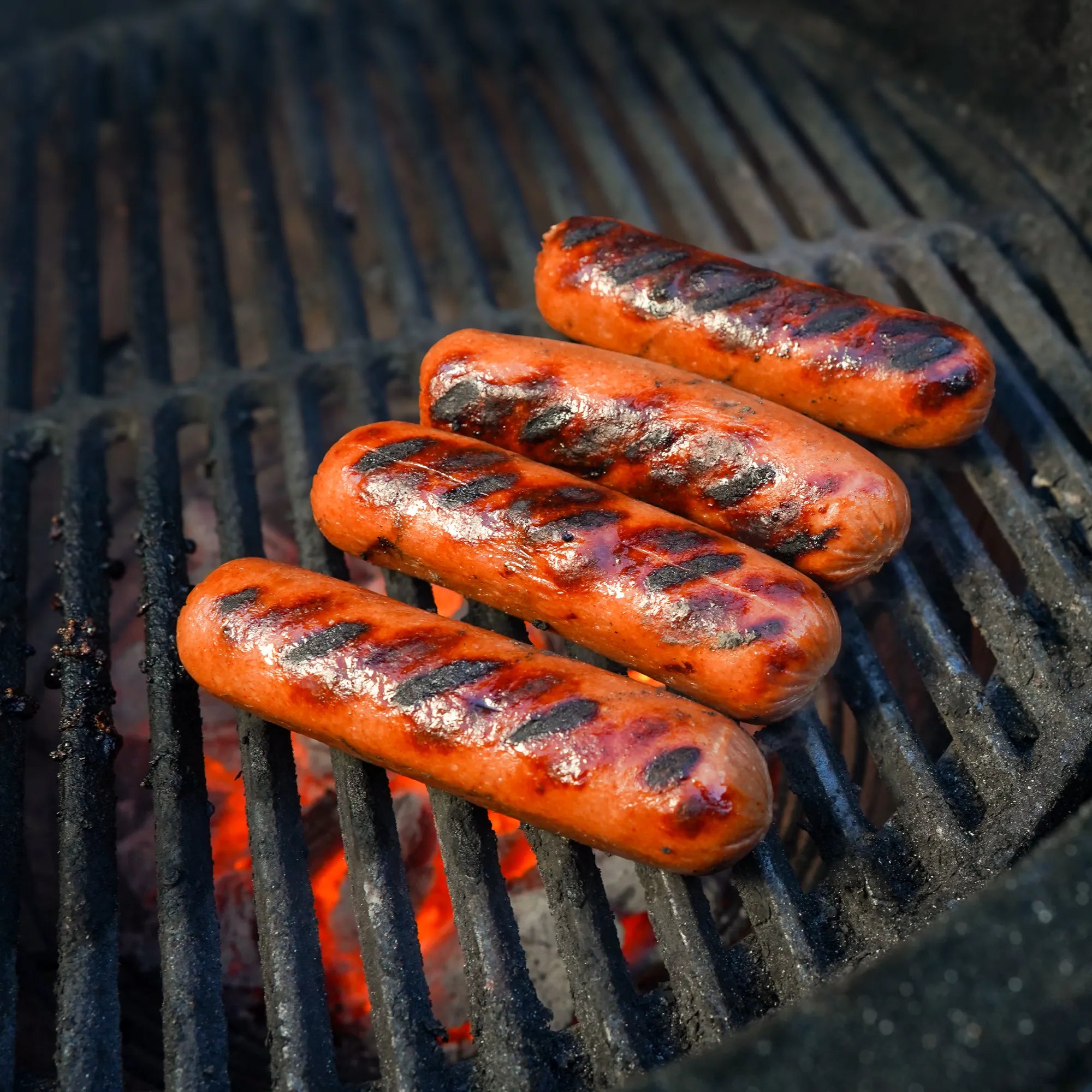 Hot Dogs Cooking on Grill