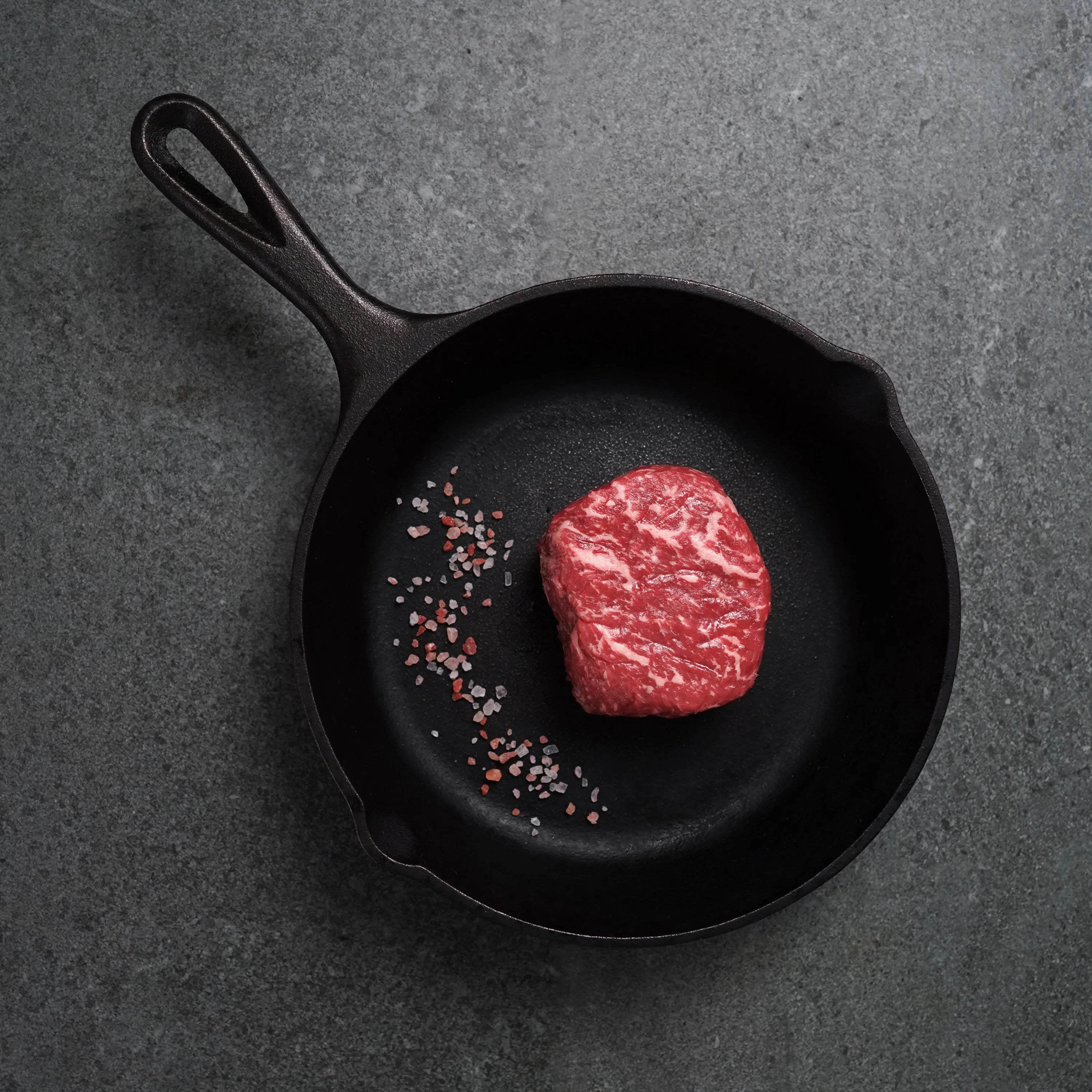 Top Sirloin Raw in Cast Iron pan